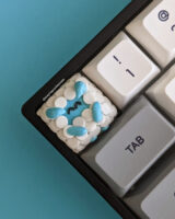 Blue sheep demon artisan keycap on a mechanical keyboard.