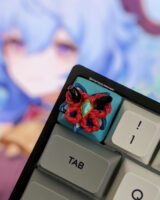 Genshin Impact keycap on the esc key with Ganyu in the background.