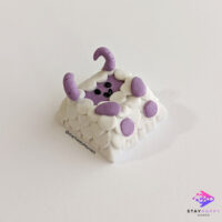 Side view of purple sheep demon artisan keycap.