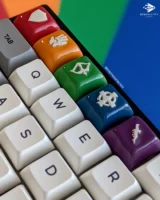 Close up of the Dungeons of Sundaria artisan keycap on a rainbow background and mechanical keyboard.